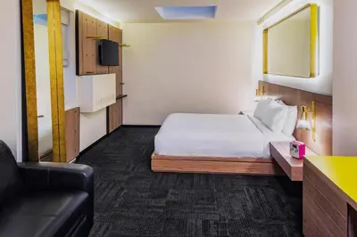 a hotel room with a bed and a couch at Hotel Shocard Broadway, Times Square in New York