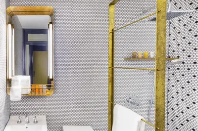 a bathroom with a shower with a sink and a mirror at Hotel Shocard Broadway, Times Square in New York