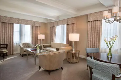 a living room with a couch and a table at Warwick New York in New York
