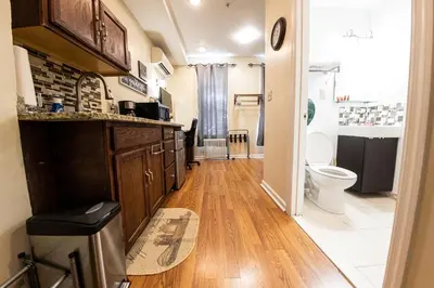 a bathroom with a sink and a toilet in it at Shefah Hotel in Union City