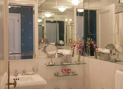 a bathroom with a sink and a mirror at The Sherry Netherland in New York