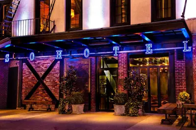 a building with blue lights on the front of it at Sohotel in New York