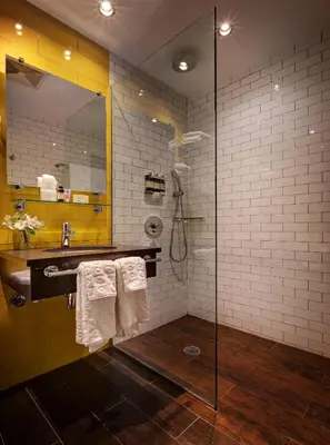 a bathroom with a shower and a sink at Sohotel in New York