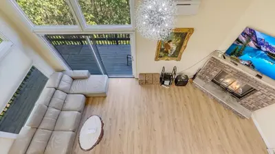 an overhead view of a living room with a couch and a fireplace at Cozy Modern Camelback House in Tannersville