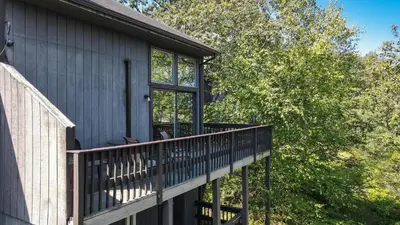 a deck on the side of a house at Cozy Modern Camelback House in Tannersville