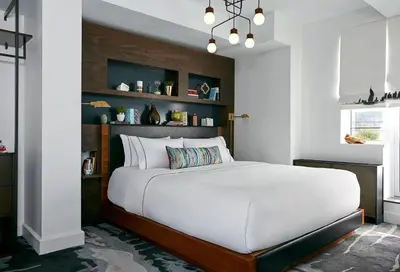 a bedroom with a large white bed in a room at The Renwick in New York