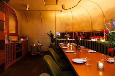 a dining room with a long table and chairs at The Renwick in New York