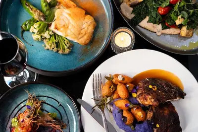 a table with three plates of food on it at Hotel Belleclaire Central Park in New York