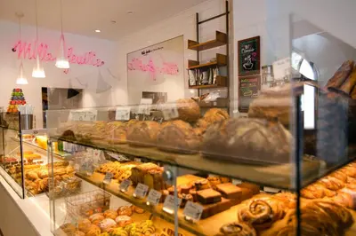 a bakery filled with lots of different types of pastries at Hotel Belleclaire Central Park in New York