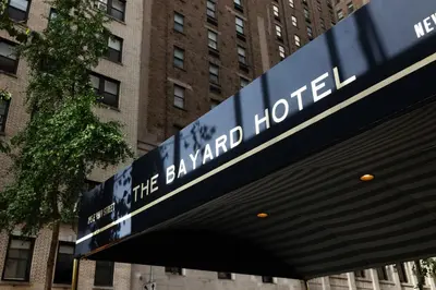 a sign that reads theamed houston in front of a building at The Bayard in New York