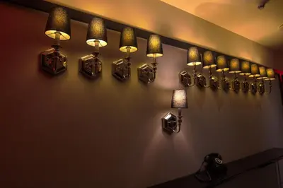 a room with many lights on a wall at The Evelyn NoMad in New York