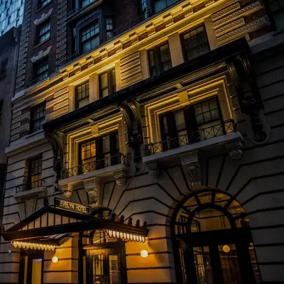 a building with a sign on the side of it at The Evelyn NoMad in New York
