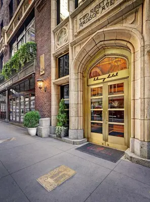 a building with an entrance to a store at Library Hotel by Library Hotel Collection in New York