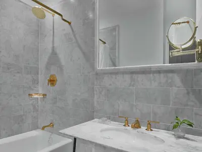 a bathroom with a sink and a mirror and a tub at Life Hotel New York in New York