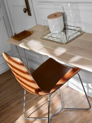 a desk with a chair sitting under a wooden table at Life Hotel New York in New York