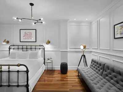 a bedroom with a bed and a couch at Life Hotel New York in New York