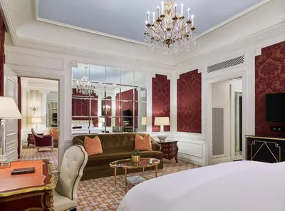 a hotel room with a bed and a chandelier at 5th & 55th Residence Club in New York