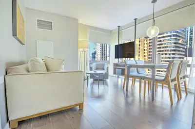 a dining room and living room with a table and chairs at Club Wyndham Midtown 45 in New York