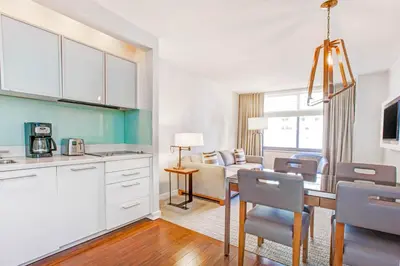 a kitchen and dining room with a table and chairs at Club Wyndham Midtown 45 in New York