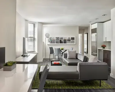 a living room with a couch and a table at AKA Times Square in New York