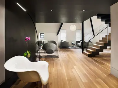 a living room with a white table and chairs at AKA Times Square in New York