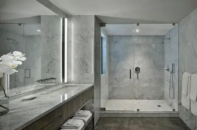 a bathroom with a tub and a shower at AKA Times Square in New York