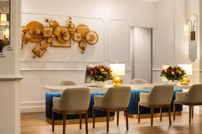 a dining room with a table and chairs at The Chemists Club Hotel in New York