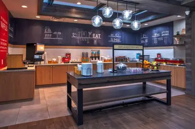 a restaurant with a table in a kitchen at Hampton Inn & Suites By Hilton- Newark Airport Elizabeth in Newark