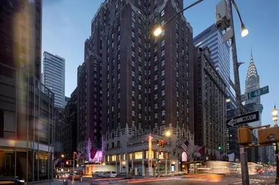 a tall building in a city with a street at The Lexington Hotel, Autograph Collection in New York
