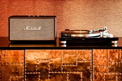 a table with a record player and a vinyl album at Roxy Hotel New York in New York