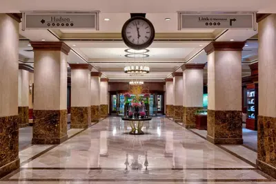 a hotel hallway with a clock on the ceiling at Sheraton New York Times Square Hotel in New York