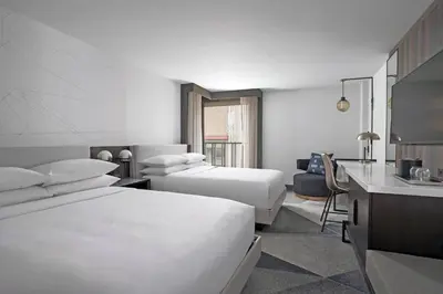 a hotel room with two beds and a kitchen at Philadelphia Marriott Old City in Philadelphia