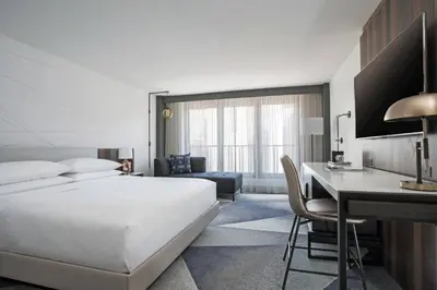 a hotel room with a bed and a desk at Philadelphia Marriott Old City in Philadelphia
