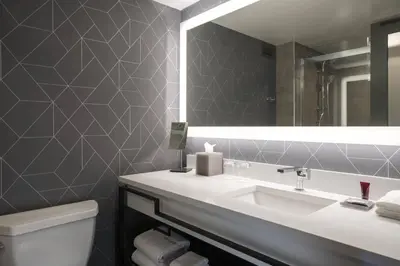 a bathroom with a sink and a mirror at Philadelphia Marriott Old City in Philadelphia