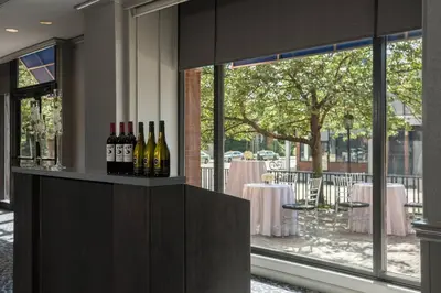 a bar with bottles of wine sitting on a counter at Philadelphia Marriott Old City in Philadelphia