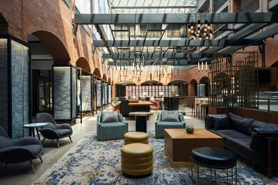a lobby with couches and chairs and tables at Philadelphia Marriott Old City in Philadelphia
