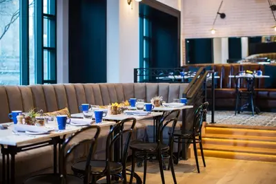 a row of tables and chairs in a restaurant at Renaissance Philadelphia Downtown Hotel in Philadelphia