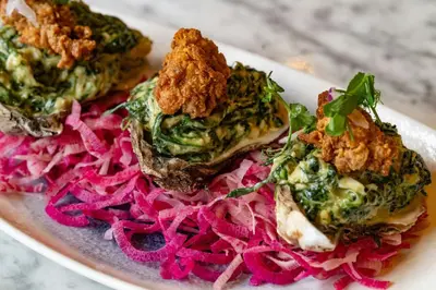 a plate of food with meat on top of red onions at Renaissance Philadelphia Downtown Hotel in Philadelphia