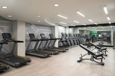 a gym with a row of treadmills and machines at Renaissance Philadelphia Downtown Hotel in Philadelphia