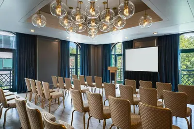 a room with a table and chairs and a projection screen at Renaissance Philadelphia Downtown Hotel in Philadelphia