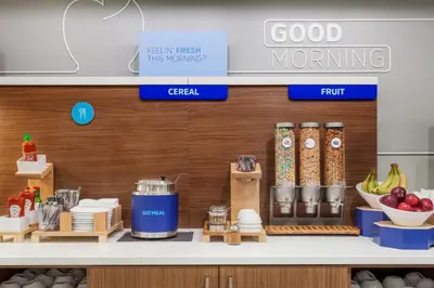 a grocery store counter with food items on a shelf at Holiday Inn Express & Suites - Middletown - Goshen by IHG in Middletown