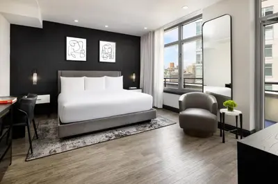 a hotel room with a bed and a desk at Arthouse Hotel in New York