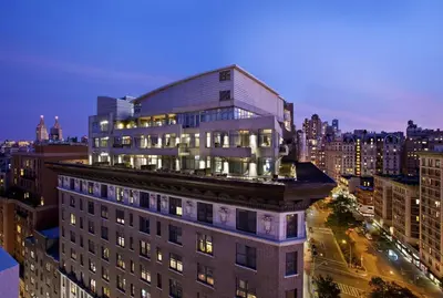 a large building in a city at night at Arthouse Hotel in New York