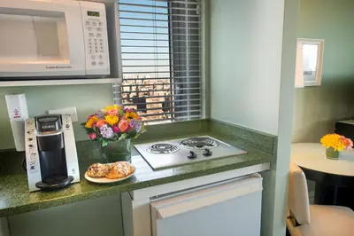 a kitchen with a stove and a plate of food at Hotel Beacon in New York