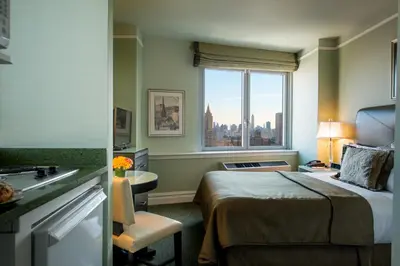 a hotel room with a bed and a window at Hotel Beacon in New York