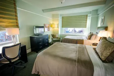 a hotel room with two beds and a television at Hotel Beacon in New York