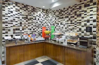 a restaurant with a counter with food on it at Hampton Inn Madison Square Garden in New York