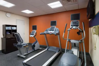 a gym with two treadmills and two ellipticals at Hampton Inn Madison Square Garden in New York