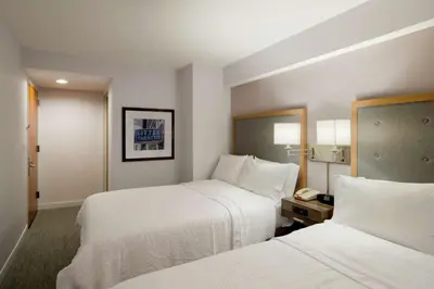 a hotel room with two beds and a phone at Hampton Inn Madison Square Garden in New York