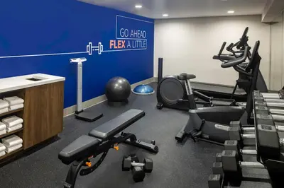 a gym with treadmills and exercise equipment in a room at Holiday Inn Express NYC Chelsea - NoMad Area by IHG in New York